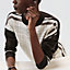 View: Worn, "Coaching Deja Vu" long-sleeve twillaine sweater
