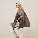 View: Worn, "H" rectangular cape poncho