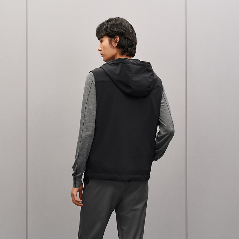 Reversible hooded vest