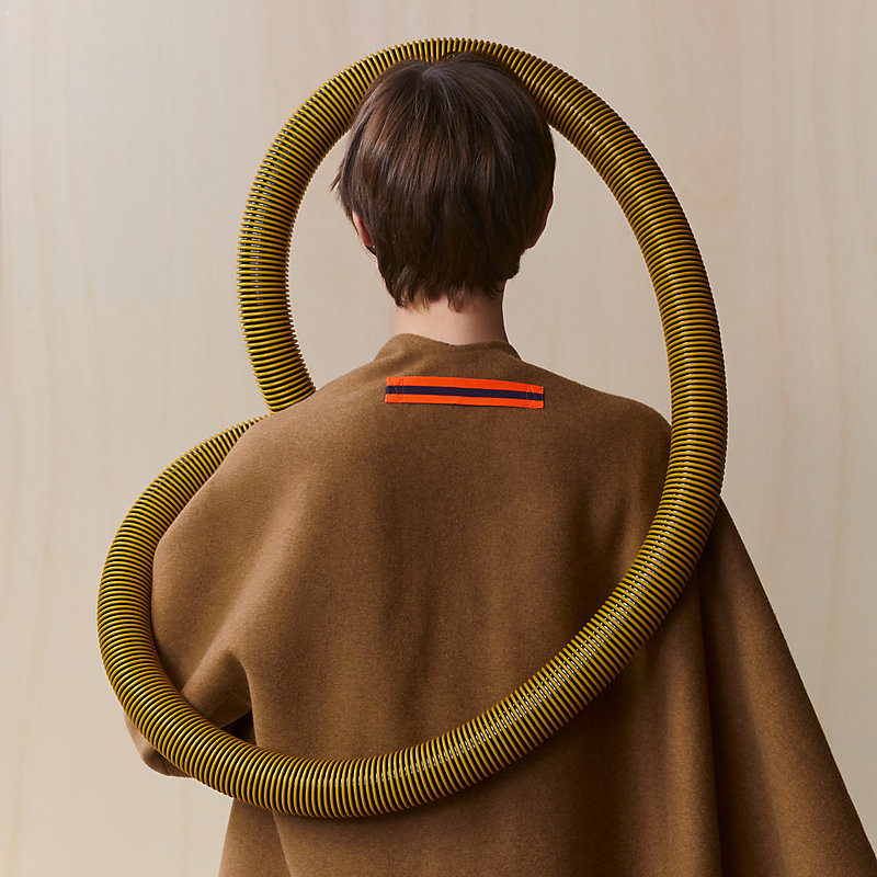 Single-sleeved reversible cape