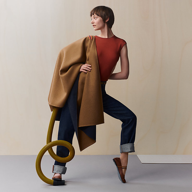 Single-sleeved reversible cape