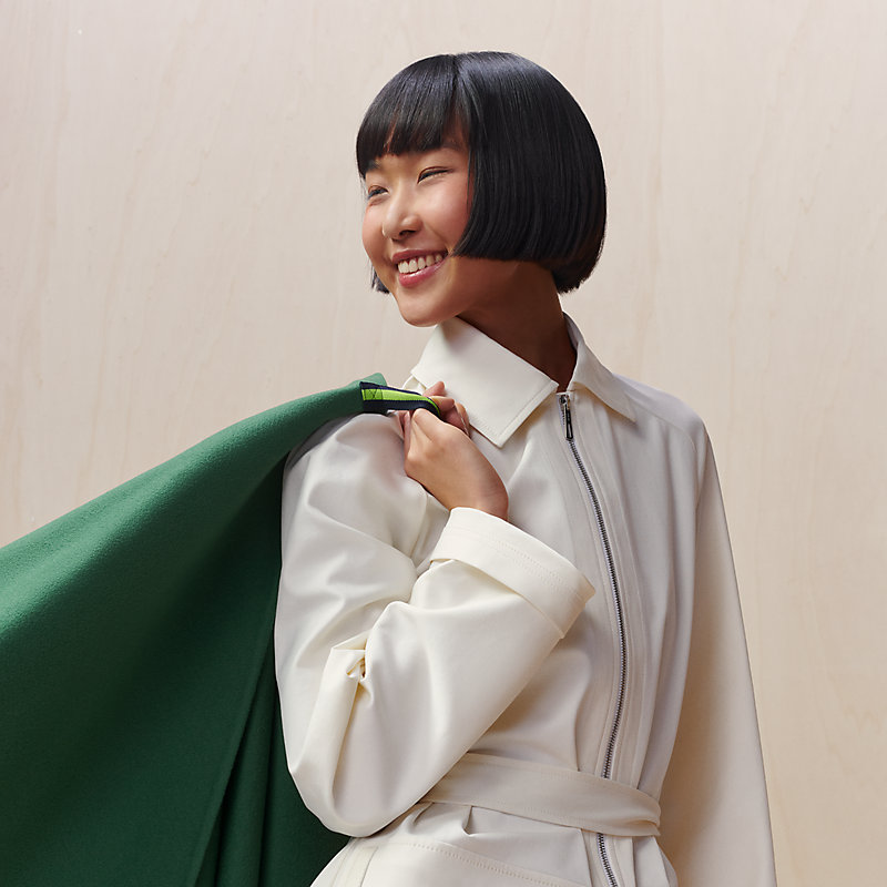 Single-sleeved reversible cape