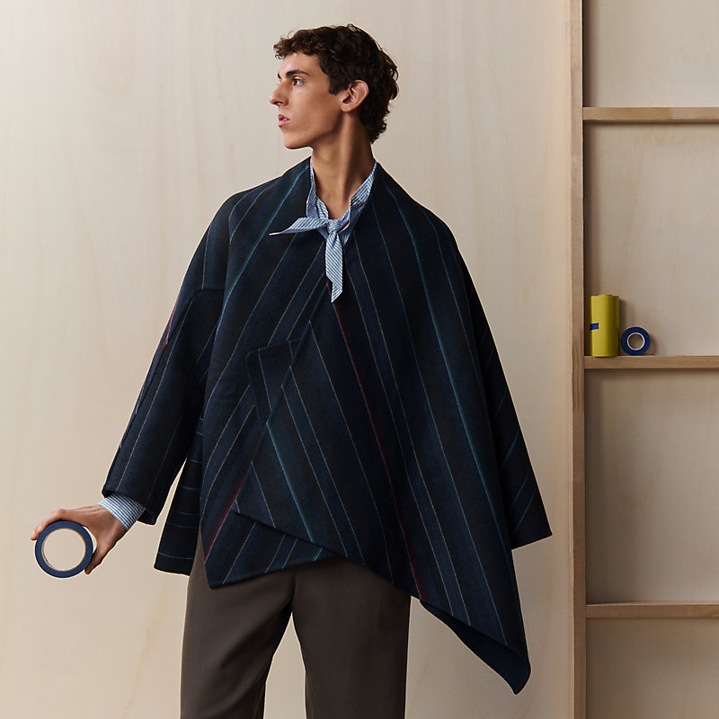 Single-sleeved reversible cape